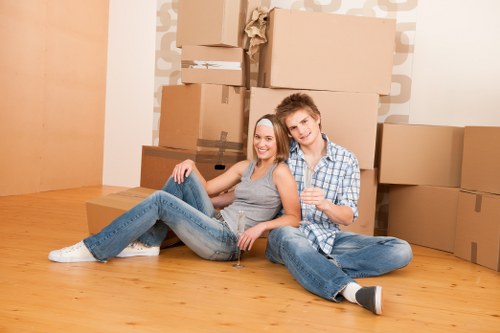 Professional packers wrapping and labelling items for transport