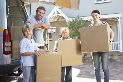 Unpacking boxes and arranging essentials in a new Hamptonhill property