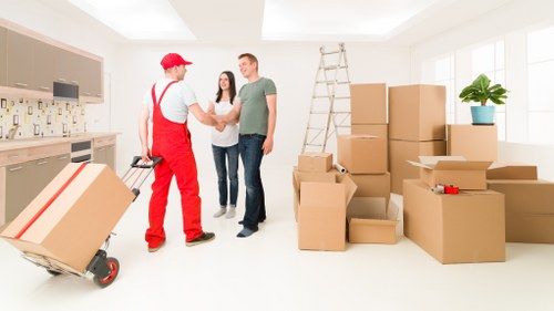 Moving boxes and furniture in a Hamptonhill apartment building